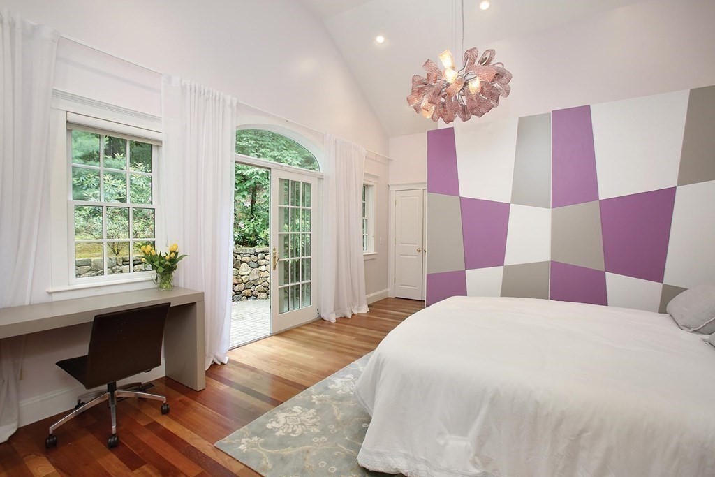 10 Cutter's Bluff Weston, MA 02493 - Photo 15 of 34 a bedroom with a bed and a chandelier