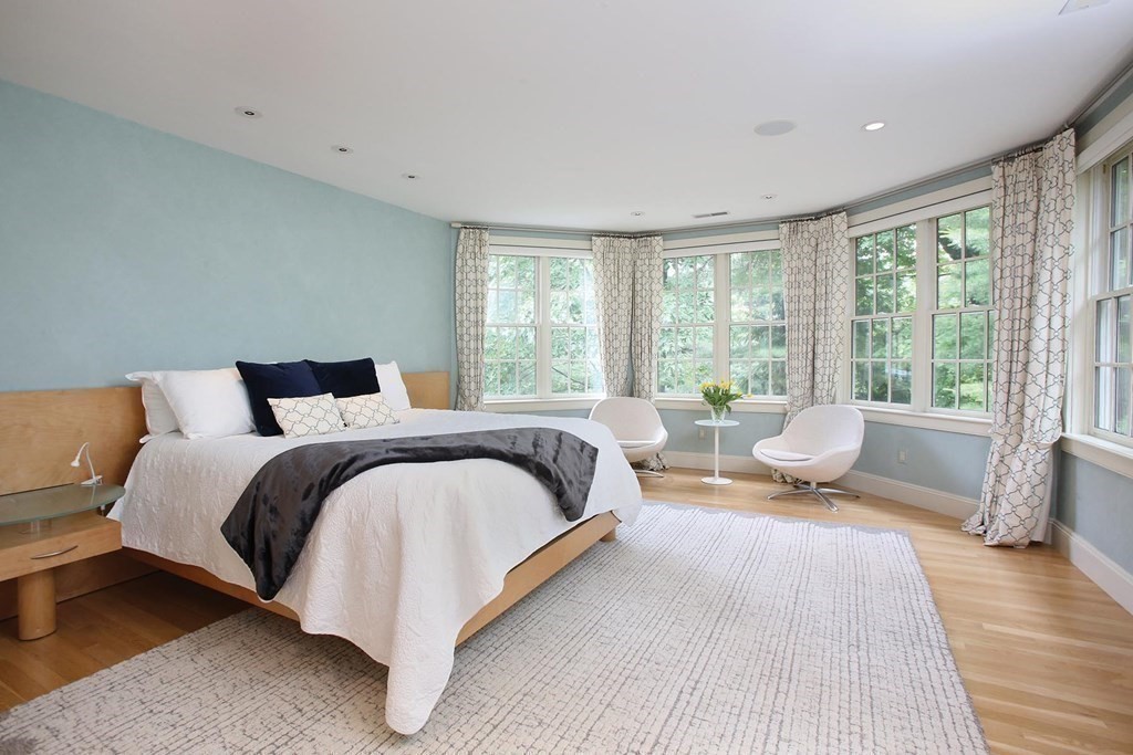 10 Cutter's Bluff Weston, MA 02493 - Photo 19 of 34 a bedroom with a bed and wooden floor