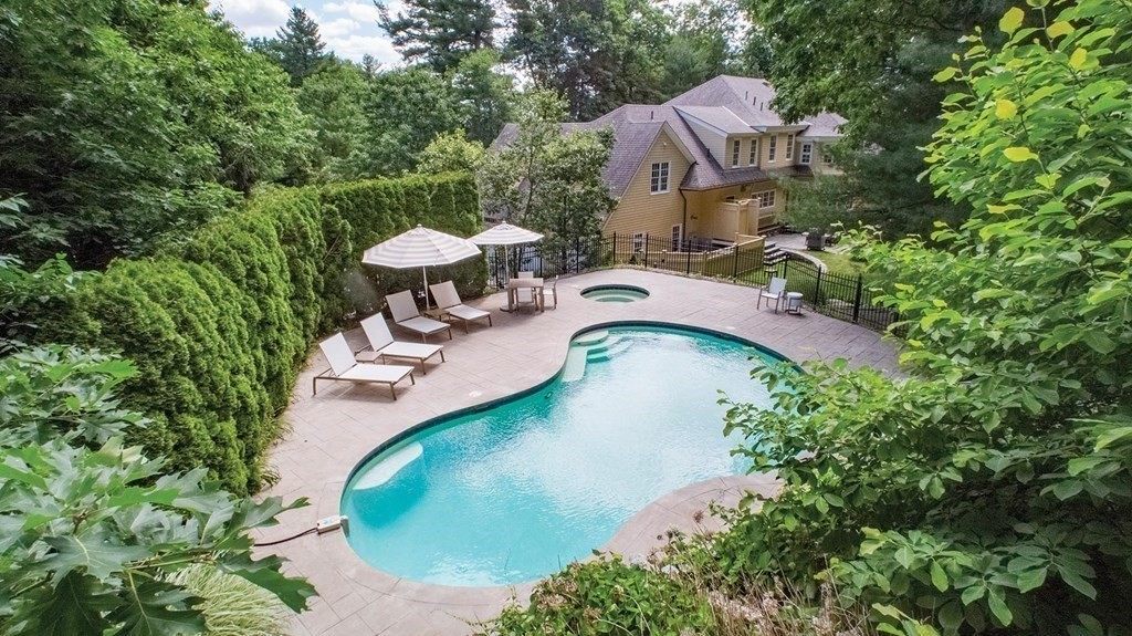 10 Cutter's Bluff Weston, MA 02493 - Photo 2 of 34 an aerial view of a house with garden space and street view