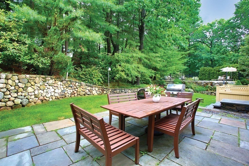 10 Cutter's Bluff Weston, MA 02493 - Photo 29 of 34 a table and chairs with the view of garden