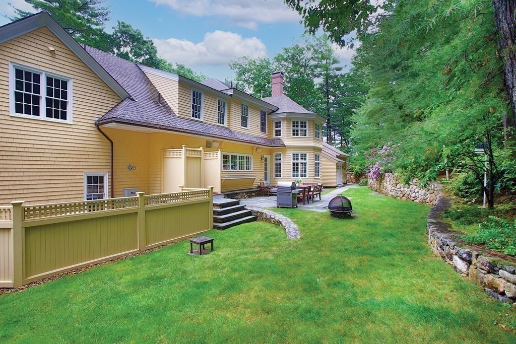 10 Cutter's Bluff Weston, MA 02493 - Photo 31 of 34 a front view of house with yard and outdoor seating