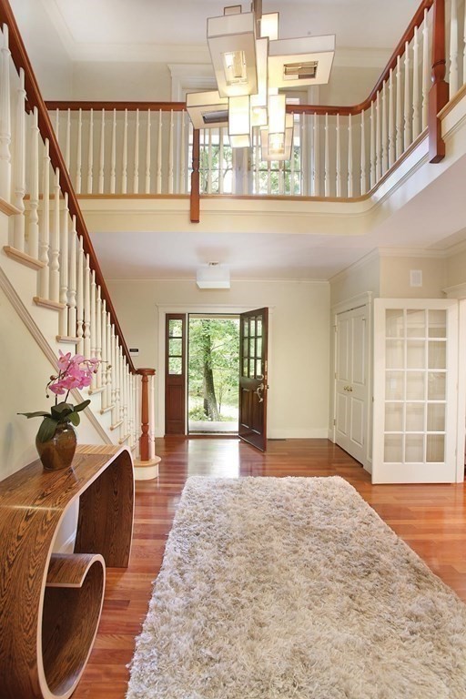 10 Cutter's Bluff Weston, MA 02493 - Photo 6 of 34 a view of entryway and hall with wooden floor