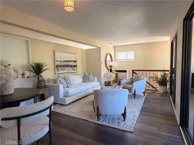 a kitchen with a stove a sink and a white cabinets