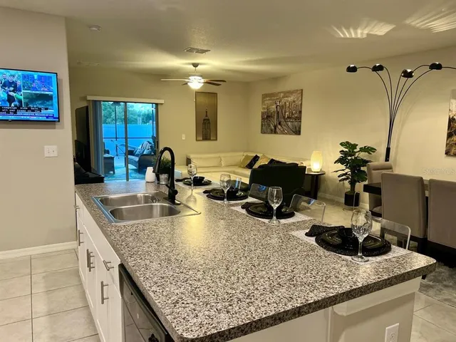 a kitchen with a granite countertop counter top space a sink and cabinets