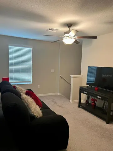 a bedroom with a bed and a tv