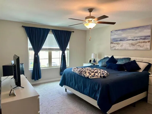 a bedroom with a bed and window