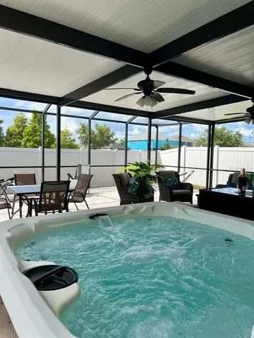 a view of a swimming pool with a patio