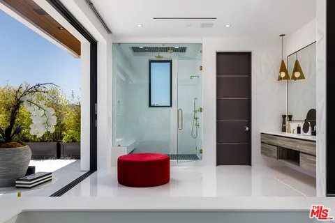 a bathroom with a tub and shower