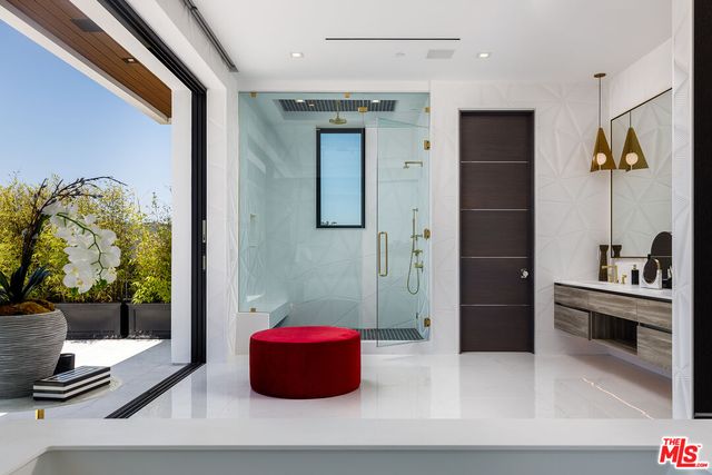 a bathroom with a tub and shower