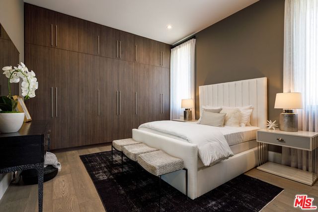 a bedroom with a bed and a table in it