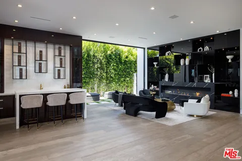 a living room with furniture window and wooden floor