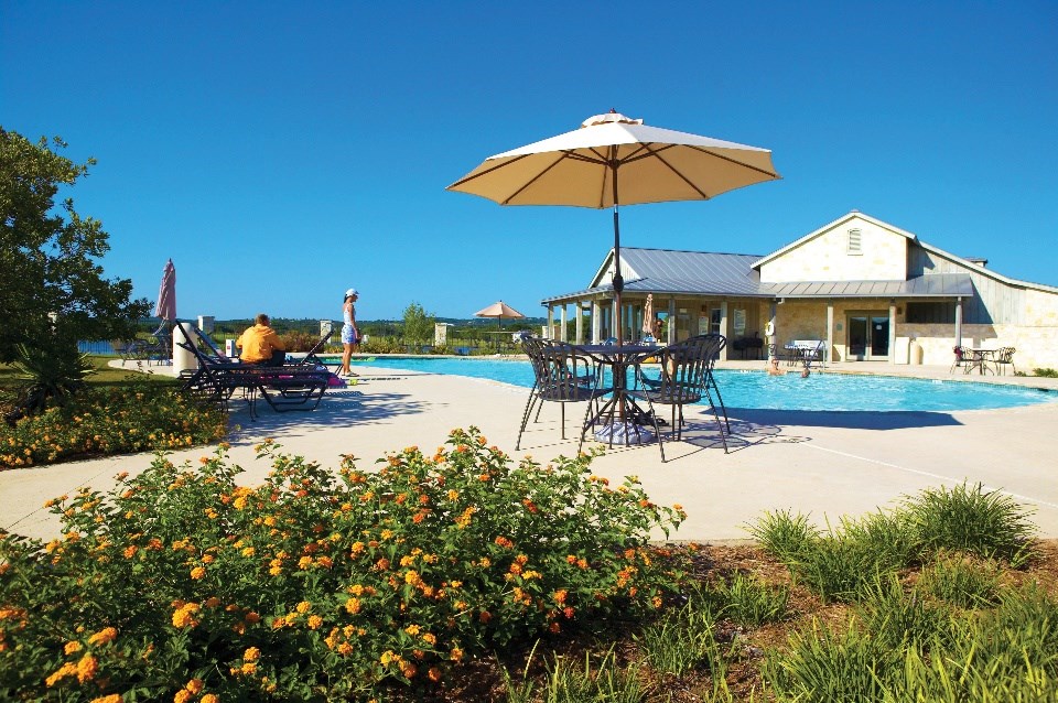 4032 Comanche Trace Drive Kerrville, TX 78028 - Photo 12 of 13 a view of a house with swimming pool and sitting area