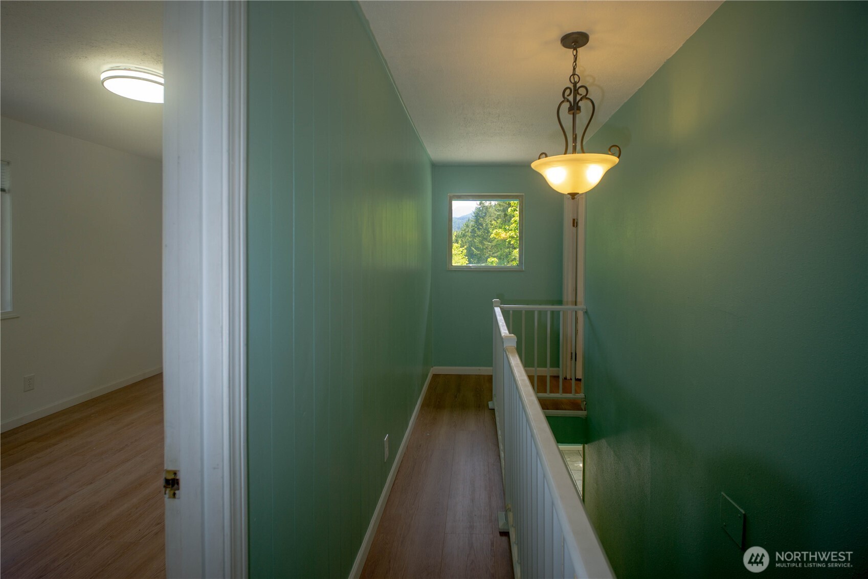 89 Slab Camp Road Sequim, WA 98382 - Photo 21 of 40 a view of a hallway with a chandelier
