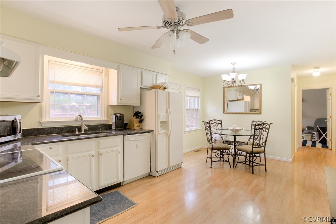 2624 Colgrave Road Midlothian, VA 23112 - Photo 10 of 29 a kitchen with stainless steel appliances kitchen island granite countertop a dining table chairs and granite counter tops