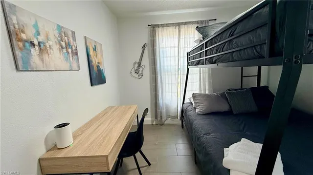a view of hallway with furniture and a window