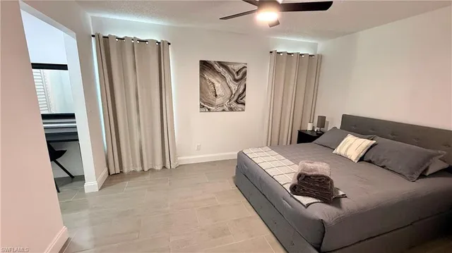 a bed room with a bed and a window