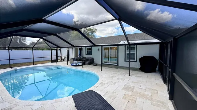 a swimming pool with view of tub