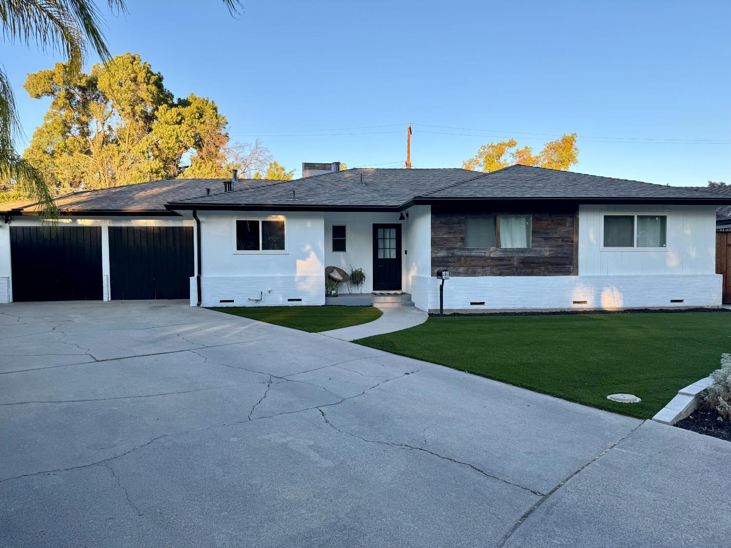 1018 Middleton Court Modesto, CA 95350 - Photo 1 of 1 a front view of a house with a yard and garage