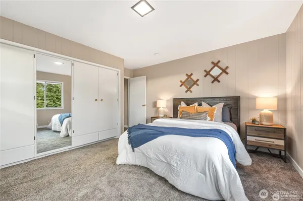 a bedroom with a bed and a window