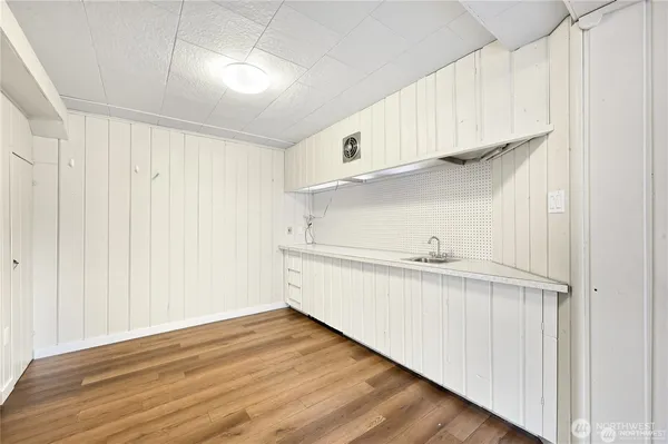 a view of cabinets and wooden floor