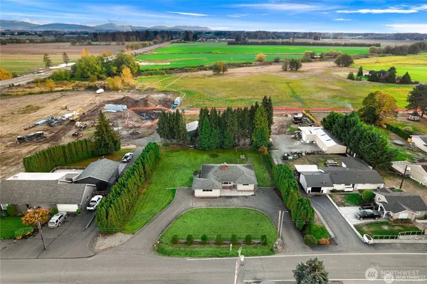 an aerial view of a city with lots of residential buildings and lake view