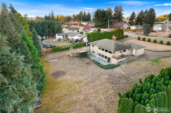 an aerial view of a house with outdoor space