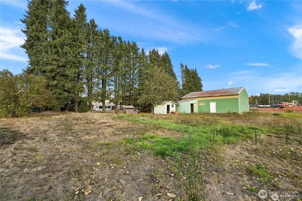a view of a back yard of a house