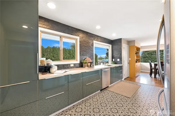 a kitchen with a sink and cabinets