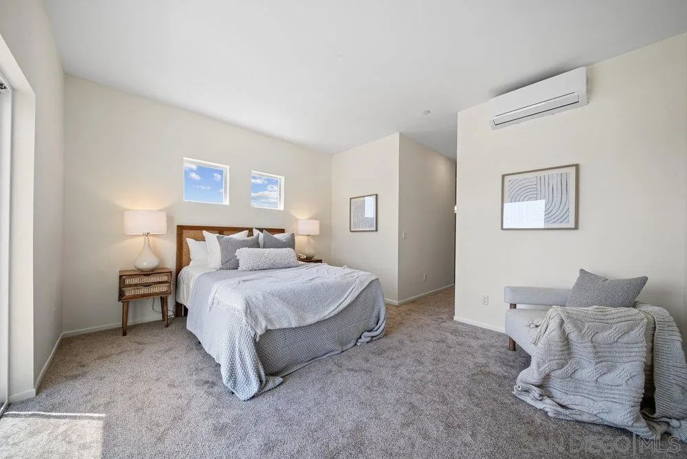 8172 Golden Avenue Lemon Grove, CA 91945 - Photo 19 of 48 a bedroom with a bed and a couch