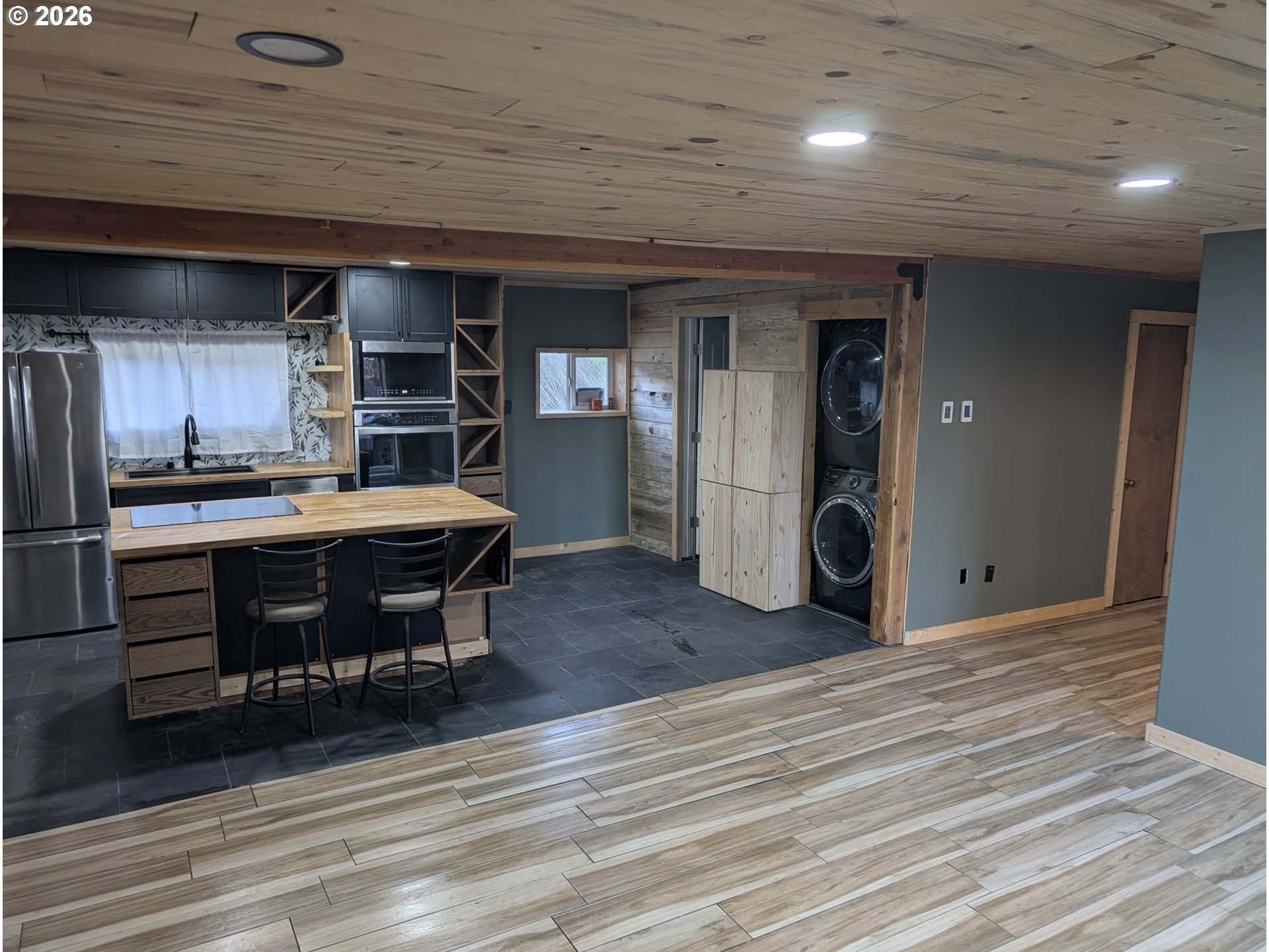44786 Mission Road Pendleton, OR 97801 - Photo 10 of 19 a living room with stainless steel appliances kitchen island granite countertop furniture and wooden floors