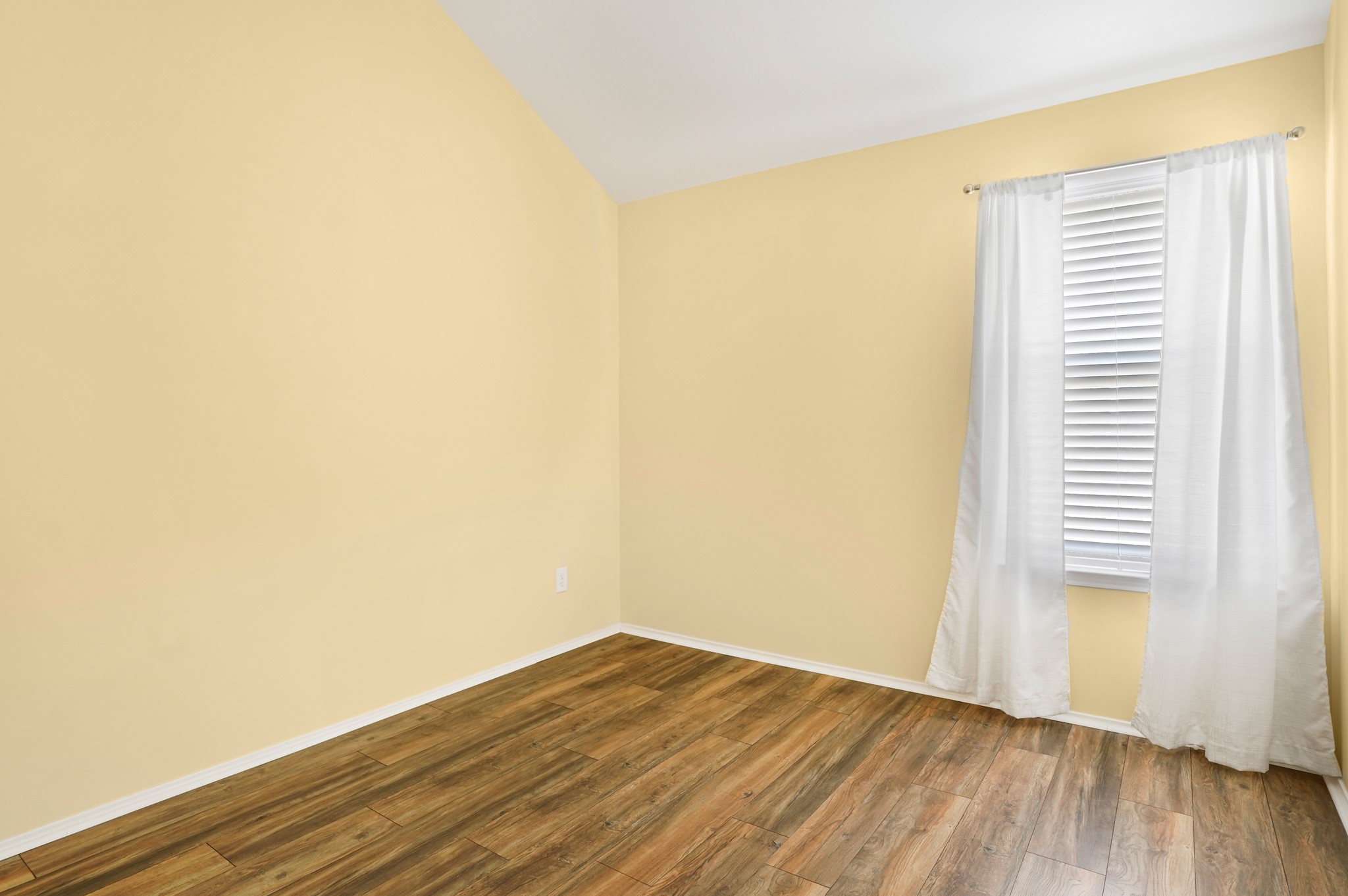 18531 Windy Village Lane Katy, TX 77449 - Photo 15 of 21 a view of a room with wooden floor and a window