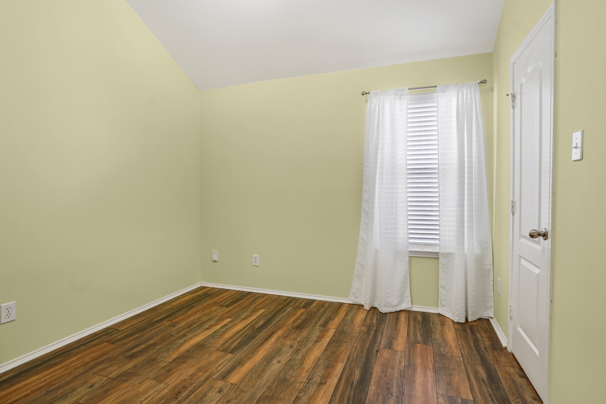 18531 Windy Village Lane Katy, TX 77449 - Photo 17 of 21 a view of a room with wooden floor and a window