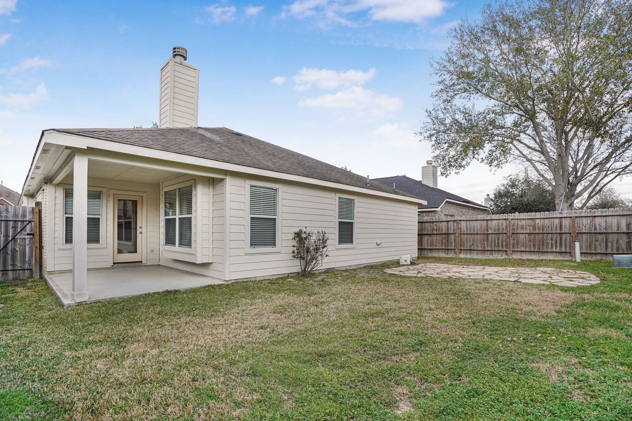 18531 Windy Village Lane Katy, TX 77449 - Photo 2 of 21 Spacious backyard with partial covered patio.