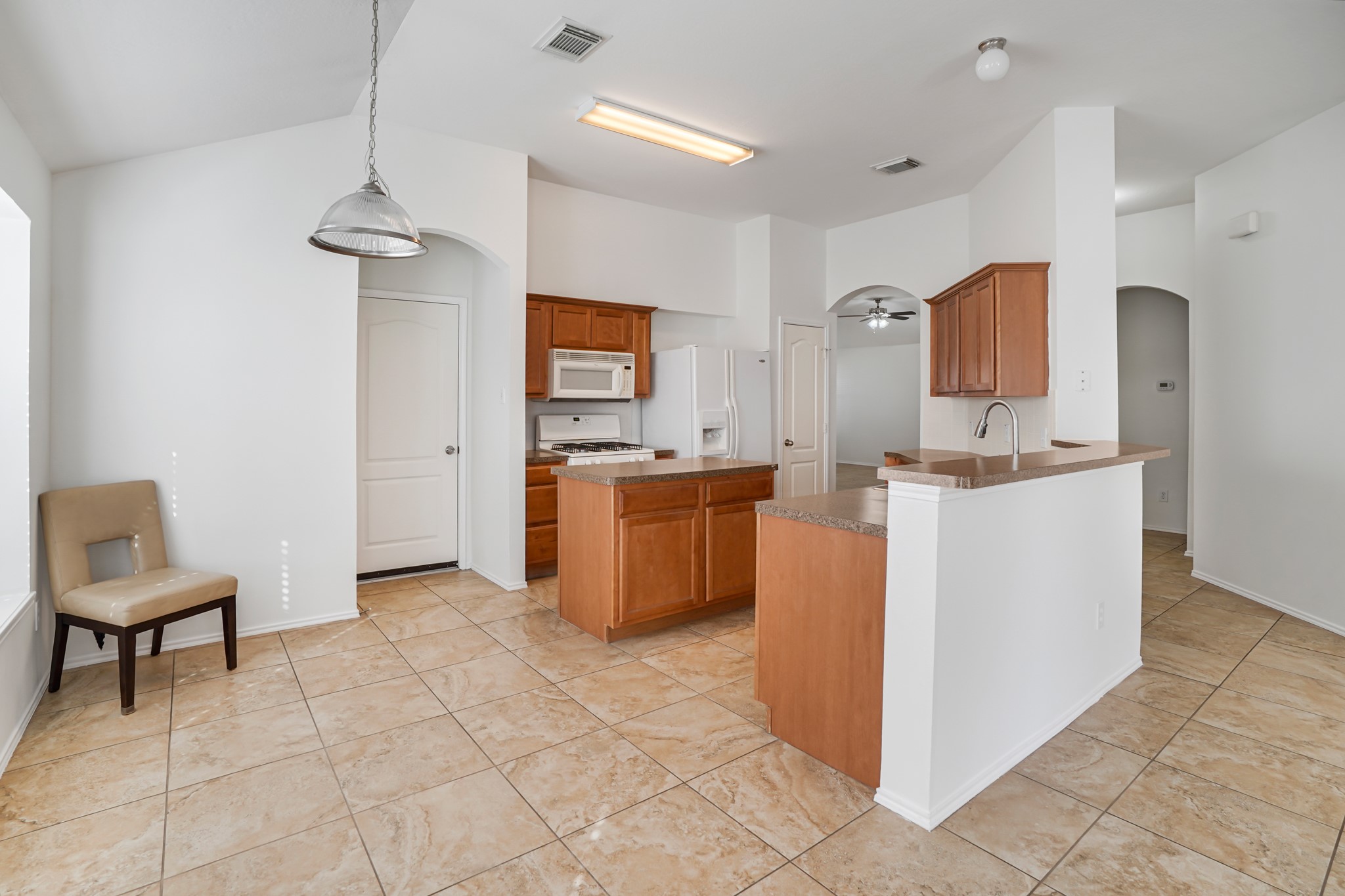 18531 Windy Village Lane Katy, TX 77449 - Photo 4 of 21 a kitchen with a cabinets and a counter top space
