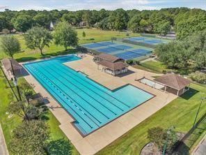 6514 Misty Springs Lane Spring, TX 77379 - Photo 28 of 49 a view of a backyard with a lake view