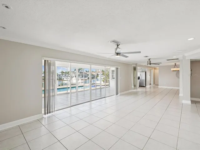 a kitchen with stainless steel appliances granite countertop a sink and refrigerator