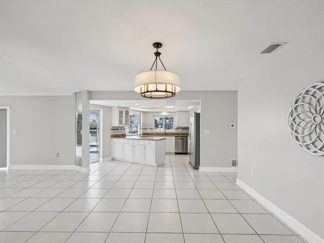 a kitchen with stainless steel appliances granite countertop a stove and a sink
