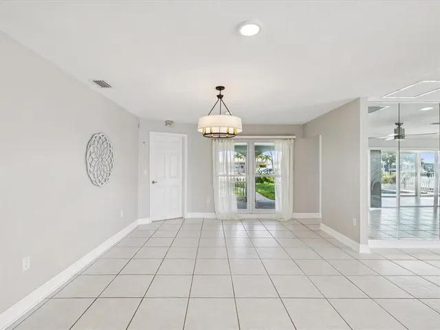 a kitchen with granite countertop stainless steel appliances a sink and cabinets
