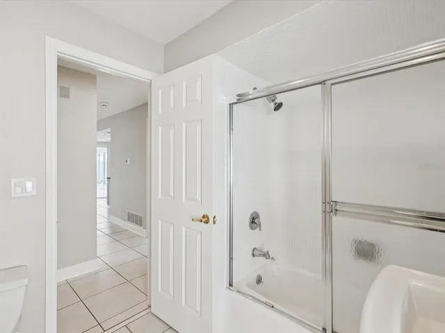 a bathroom with a bathtub and a toilet