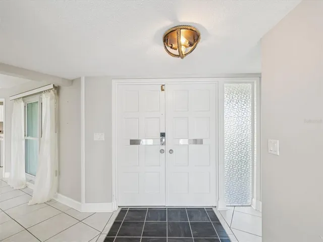 a view of a room with window and fan