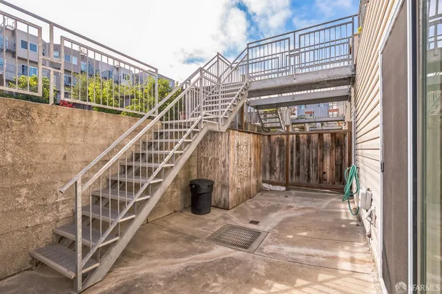 a view of a bedroom with washer and dryer