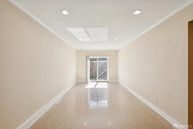 a view of an empty room with a window