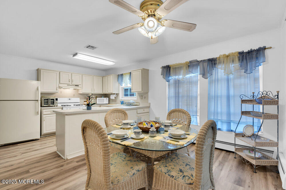 148 Davenport Road Toms River, NJ 08757 - Photo 15 of 49 a view of a dining room with furniture and wooden floor