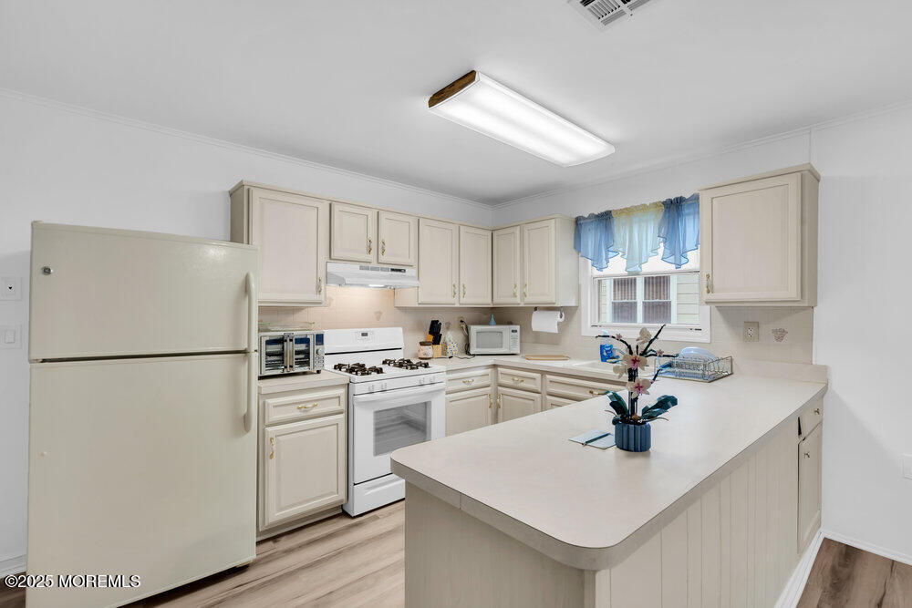 148 Davenport Road Toms River, NJ 08757 - Photo 19 of 49 a kitchen with a sink stainless steel appliances and refrigerator