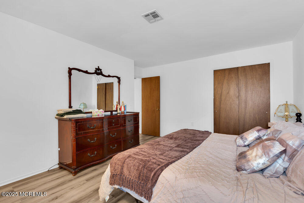 148 Davenport Road Toms River, NJ 08757 - Photo 26 of 49 a bedroom with a bed and a dresser