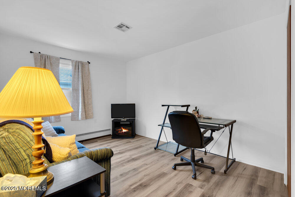 148 Davenport Road Toms River, NJ 08757 - Photo 30 of 49 a living room with furniture and a flat screen tv
