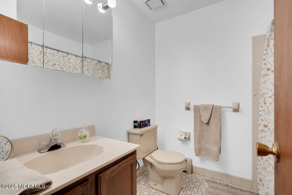 148 Davenport Road Toms River, NJ 08757 - Photo 31 of 49 a bathroom with a sink toilet and shower