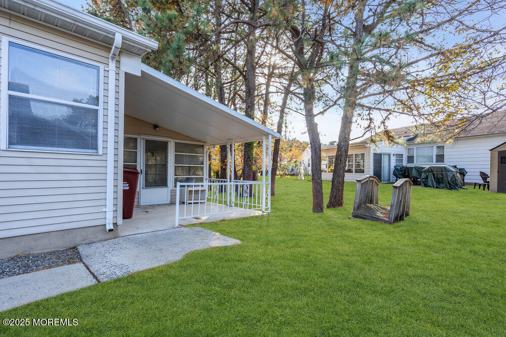 148 Davenport Road Toms River, NJ 08757 - Photo 34 of 49 a view of a house with backyard porch and sitting area