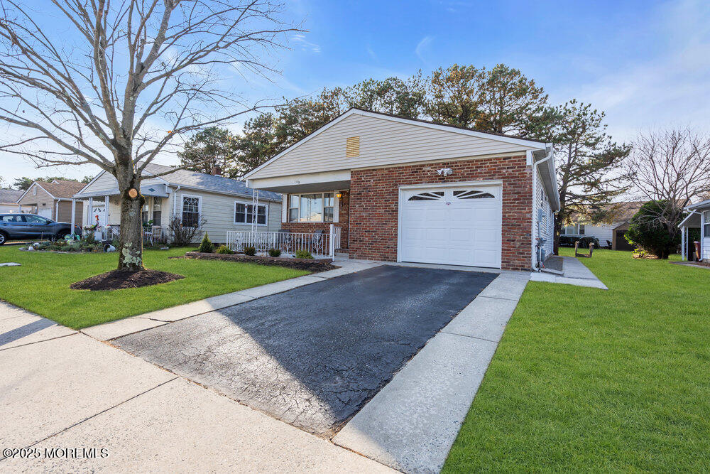 148 Davenport Road Toms River, NJ 08757 - Photo 43 of 49 a front view of house with yard and green space