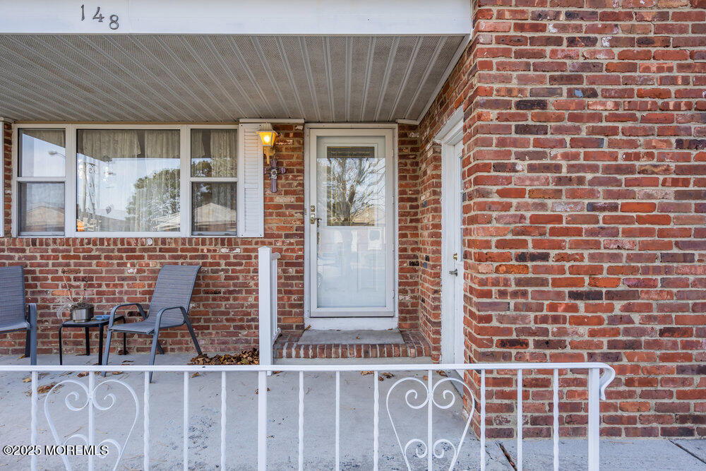 148 Davenport Road Toms River, NJ 08757 - Photo 48 of 49 a front view of a house with a glass door